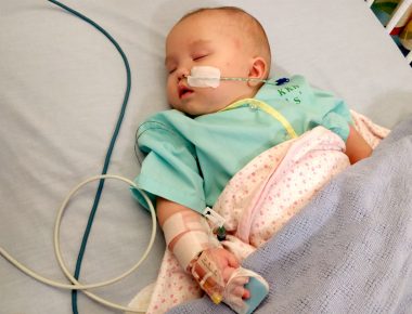 AADC diagnosis | AADC News | As an infant, Rylae-Ann, now 3, sleeps in a hospital bed connected to various tubes and cables 