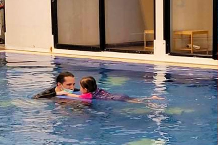 water therapy | AADC News | Richard and Rylae-Ann swim in an indoor heated saltwater pool for aqua therapy.