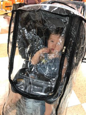 finding a doctor | AADC News | Rylae-Ann rides in her stroller behind a protective shield on the way to a doctor visit