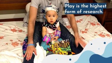 learning | AADC News | Rylae-Ann sits in front of her dad, Richard, and engages in play-based learning.