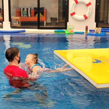 friendships | AADC News | Richard Poulin III swims with his daughter, Rylae-Ann, in an indoor pool