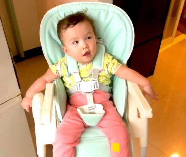 administering medication | AADC News | Rylae-Ann sits upright in her chair to take her medicine.