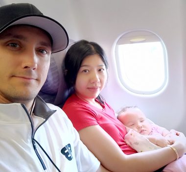 clinical trial | AADC News | Richard, Judy, and their daughter, Rylae-Ann, take a photo on the airplane as they travel from Singapore to Taiwan for a clinical trial.