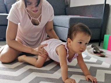 exercises | AADC News | Rylae-Ann in a crawling position, held at the legs by her mother