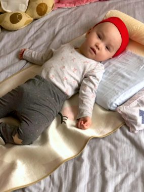 feeding issues | AADC News | Rylae-Ann is propped on a blanket and flat pillow to prevent aspiration after feeding.