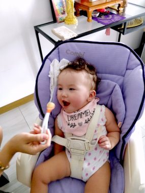 feeding issues | AADC News | Rylae-Ann opens her mouth as she's fed a spoonful of pureed food