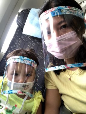 children with special needs | AADC News | photo of Rylae-Ann, left, and her mother, on the plane in safety masks