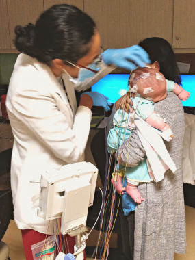 tests to find AADC deficiency | AADC News | A technician attaches electrodes to Rylae-Ann's head for an electroencephalogram.