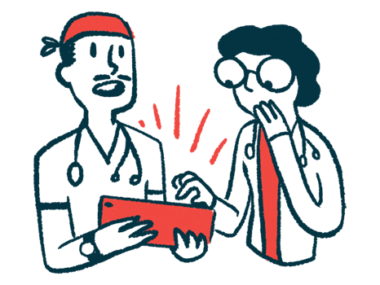 Two doctors review information on an electronic tablet.