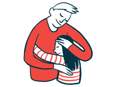 An adult hugs a child while also placing one hand on the youngster's head.