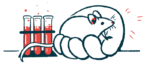 An illustration of a mouse in a human hand by vials of blood.