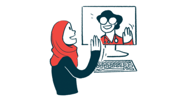 A doctor and patient wave to each other at the start of a video appointment.