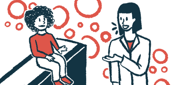 A doctor speaks to a child siting on an examination table.